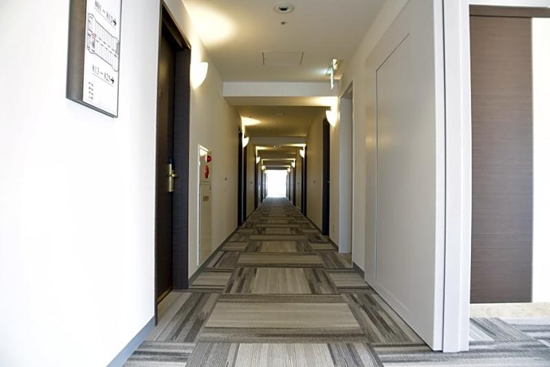 Hotel Port Plaza Chiba Exterior photo A typical hotel corridor